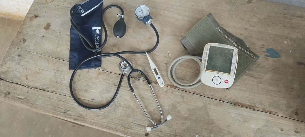 Stethoscope, thermometer and blood pressure monitors on a table